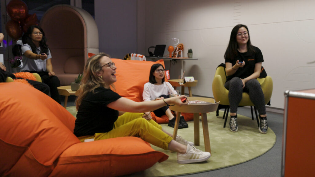 Image of the PlayRoom in Games Studio Office in Zug. Games Studio Team members playing games.